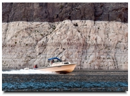 A United States Bureau of Reclamation boat speeds along at Lake Mead on Tuesday, Jan. 12, 2016. As a long-term drought continues, a white 